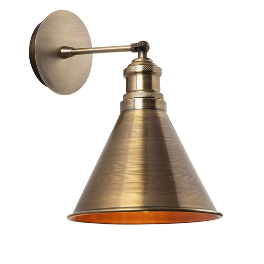 Antique brass wall light with conical shade, vintage appeal, and elegant design for sophisticated spaces.