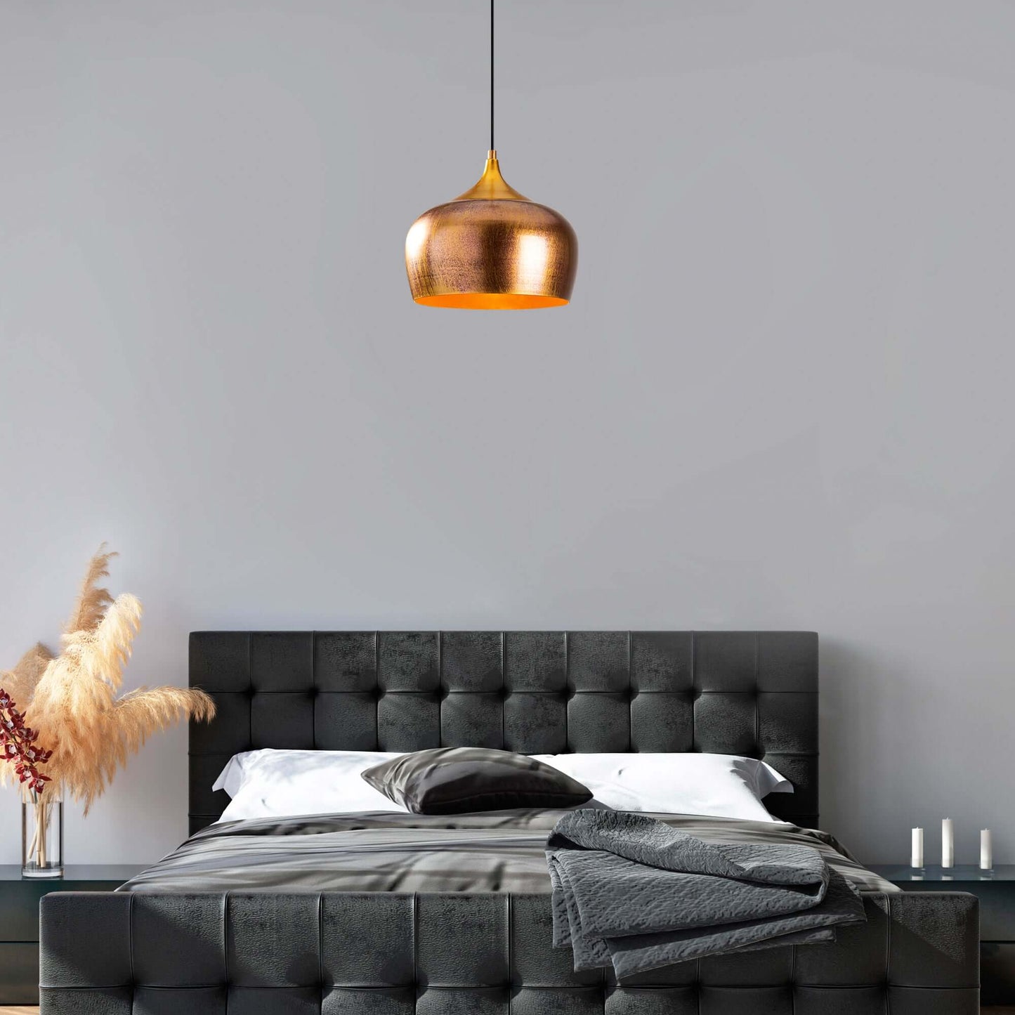 Brushed gold dome pendant light fixture emitting warm glow.