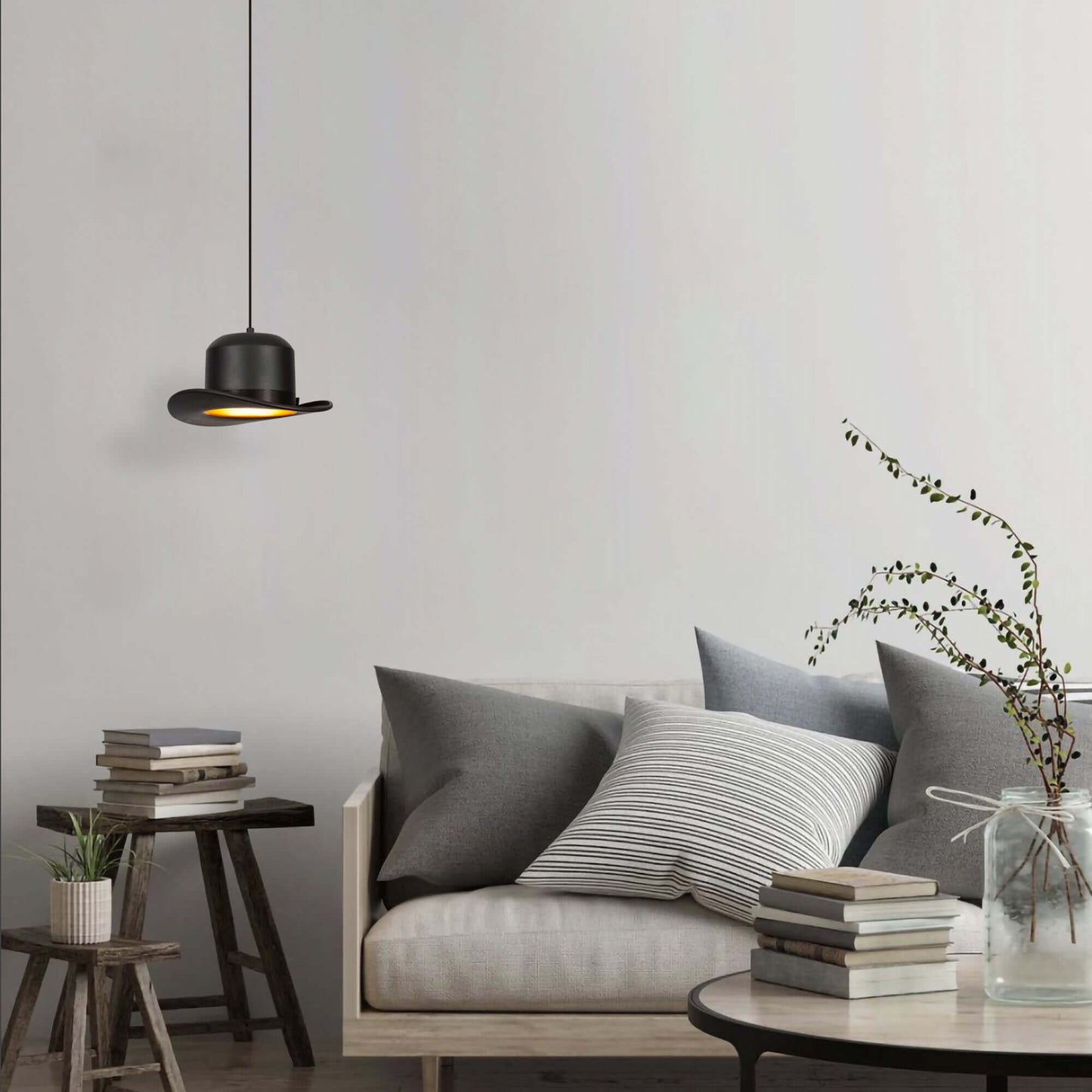 Classic hat pendant light casting warm glow, playful design for creative spaces.