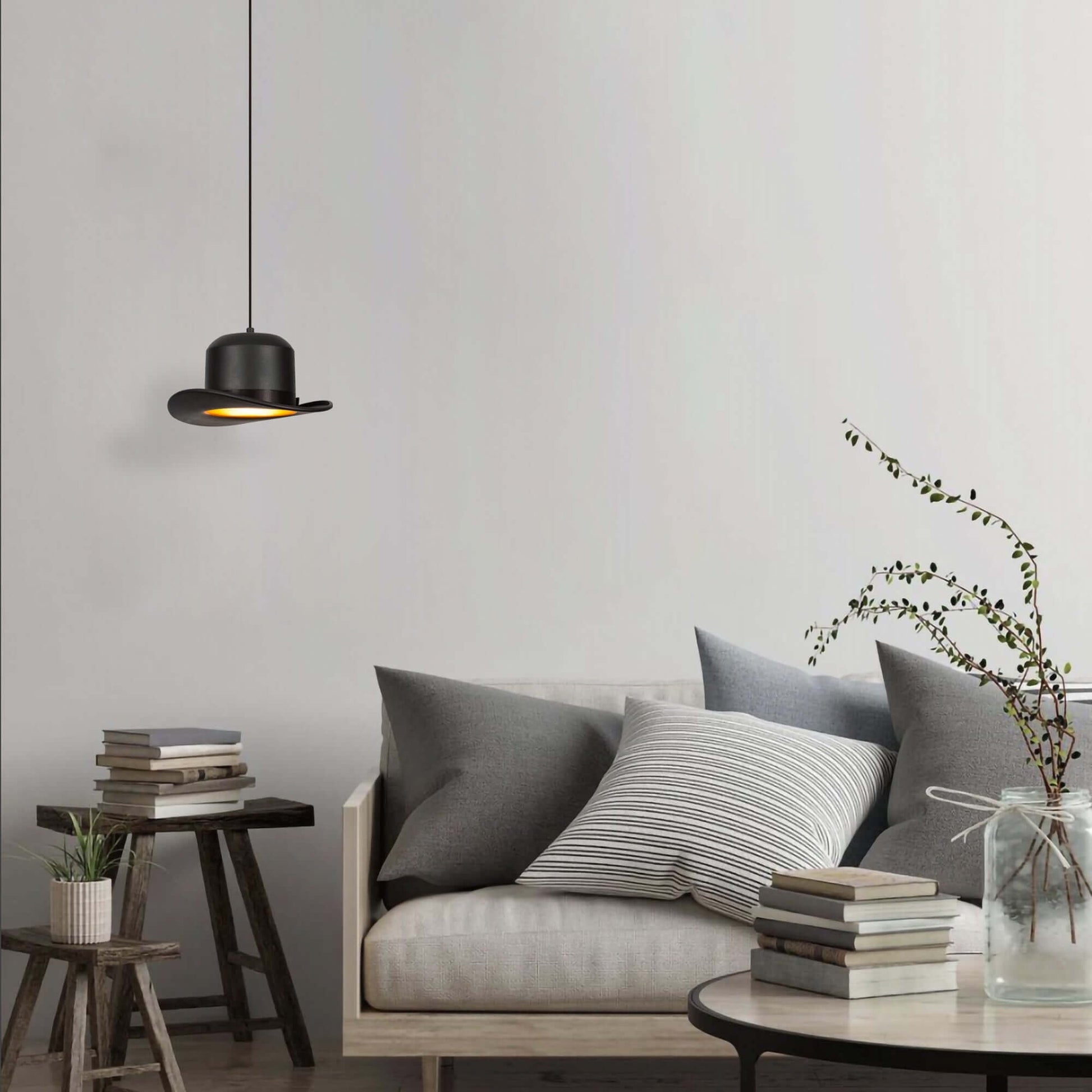 Classic hat pendant light casting warm glow, playful design for creative spaces.