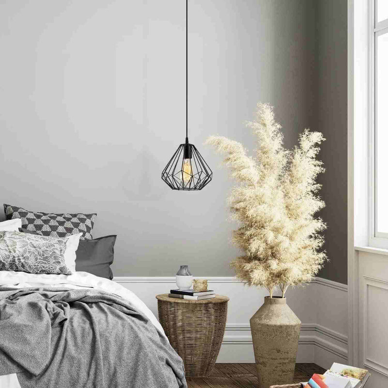 Geometric metal frame pendant light with exposed bulb, industrial chic design.