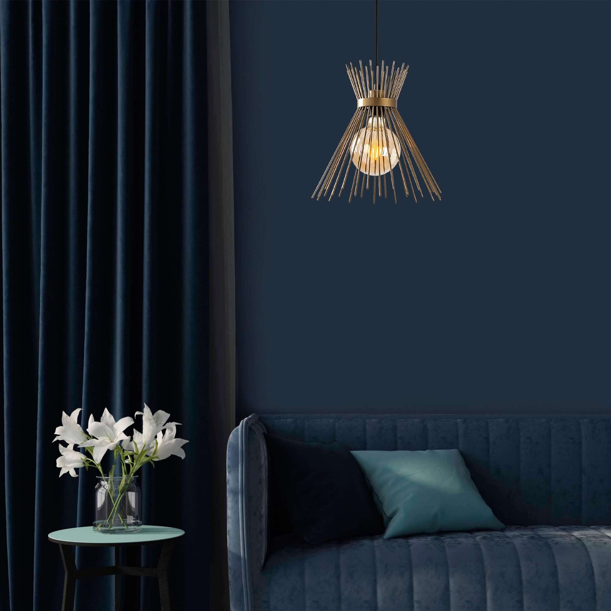 Golden spire pendant light fixture with exposed bulb, adding luxury and sophistication to room decor.