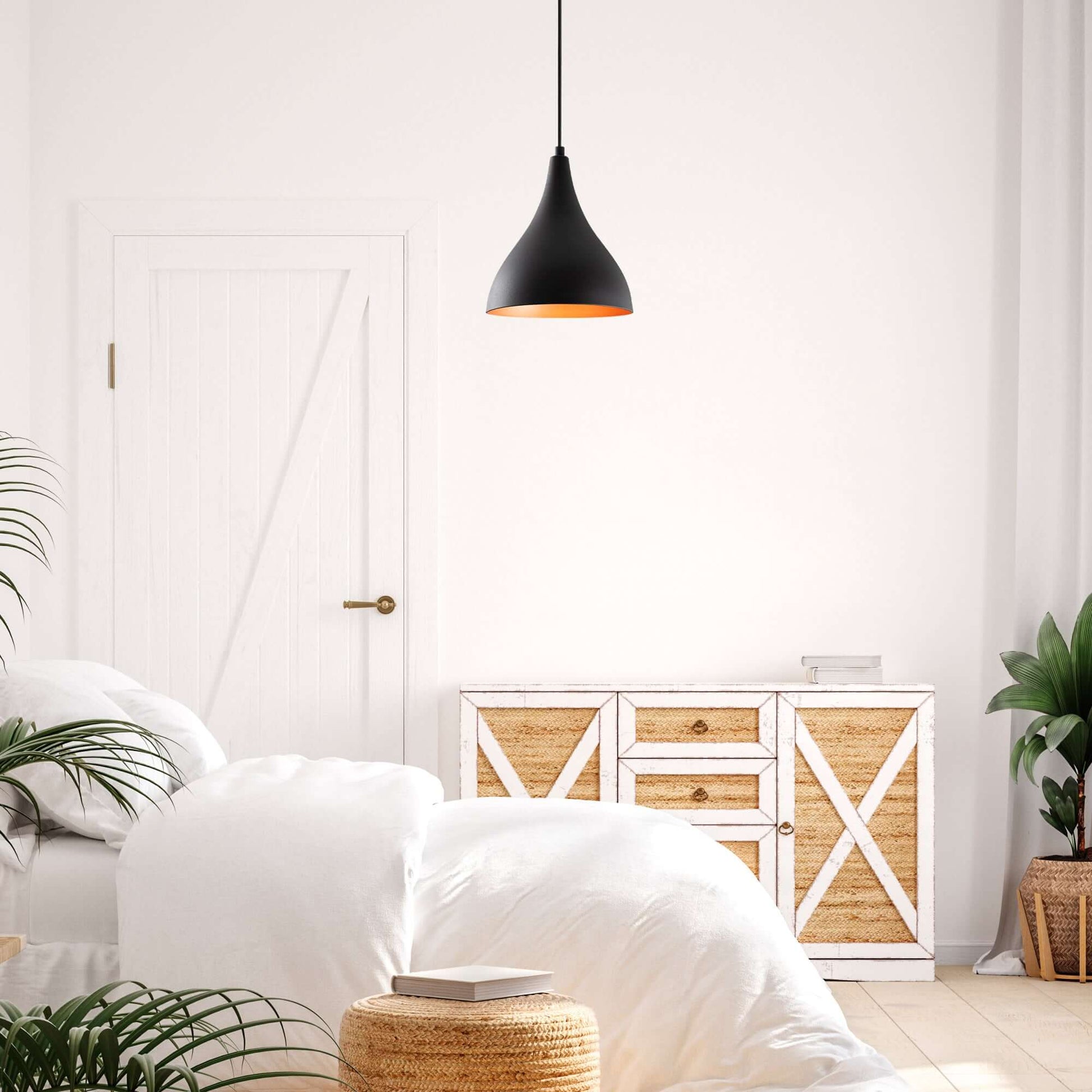 Modern matte black pendant light with warm interior glow, perfect for cozy ambiance in living spaces.