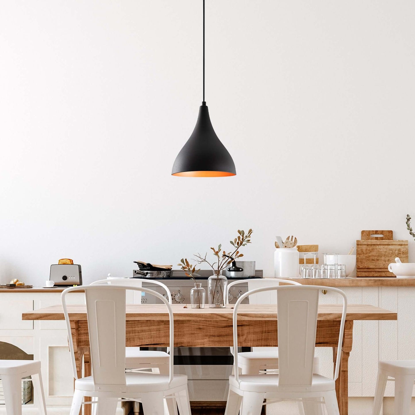 Modern matte black pendant light with warm interior glow, perfect for cozy ambiance in living spaces.