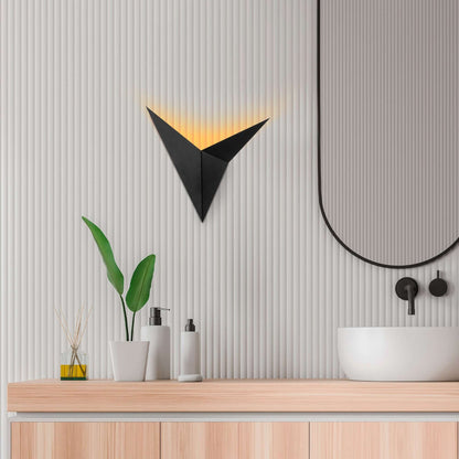 Triangular black geometric wall light fixture for modern rooms.