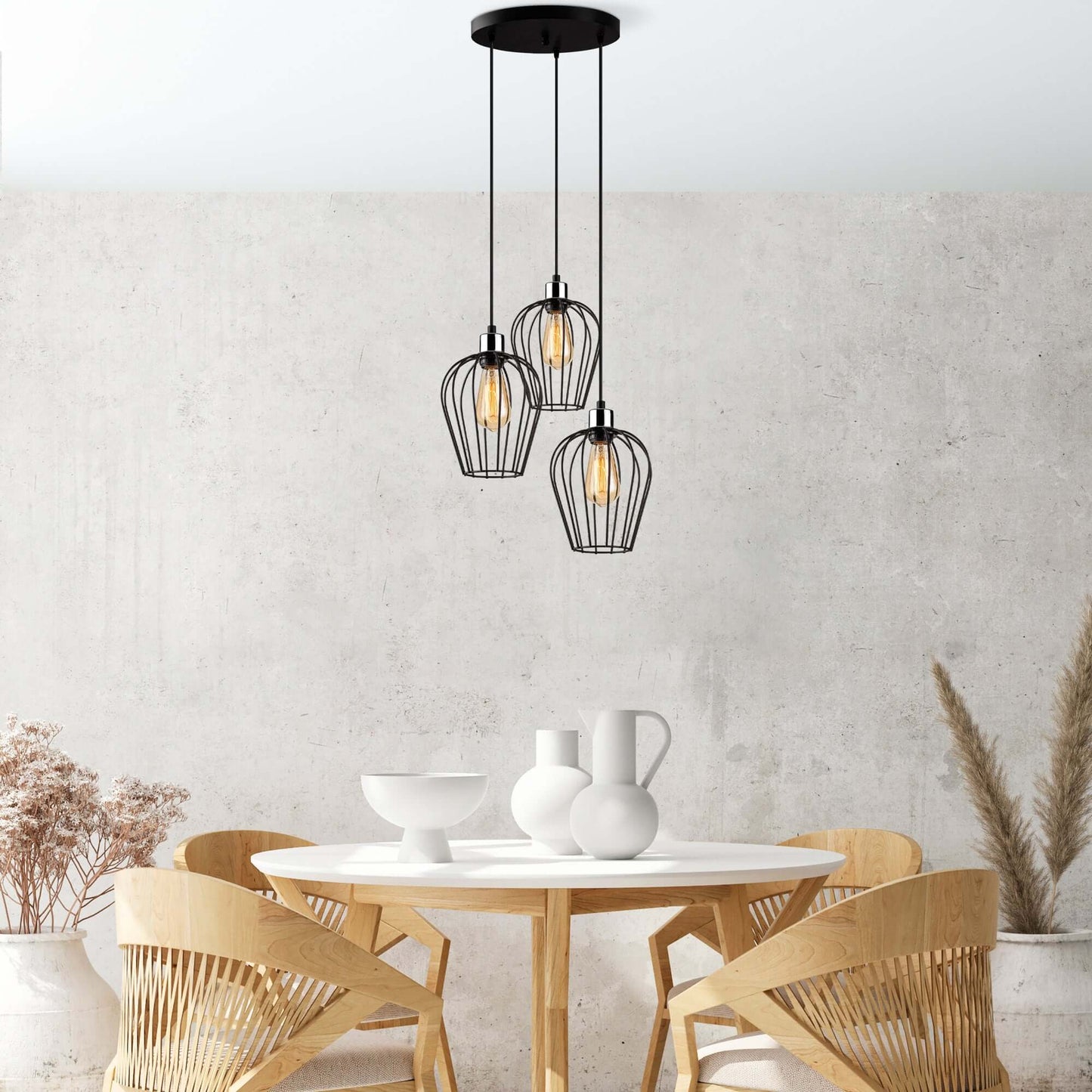 Cage Trio Pendant with modern industrial cage-like shades showcasing bulbs.