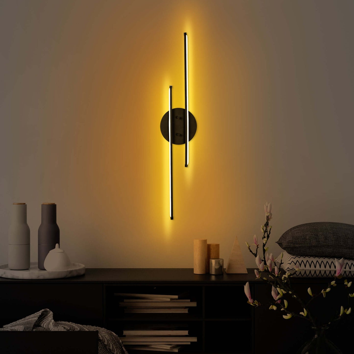 Dual Beam Wall Light in Black Finish emitting soft glow from two elegant bars