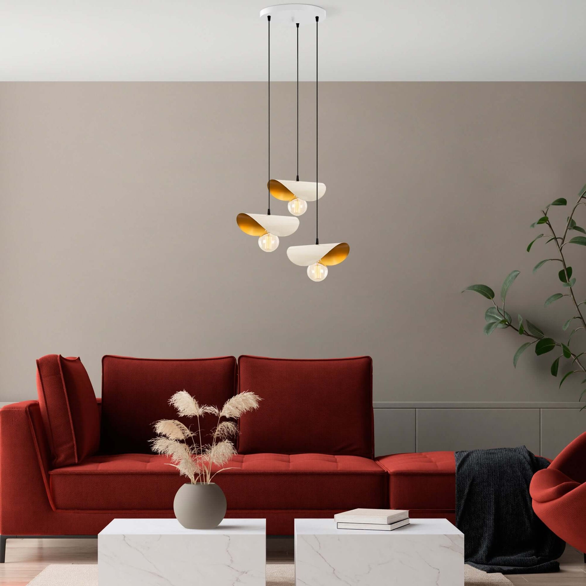 Eclipse Glow Pendant Trio with golden interior shades resembling flower petals.