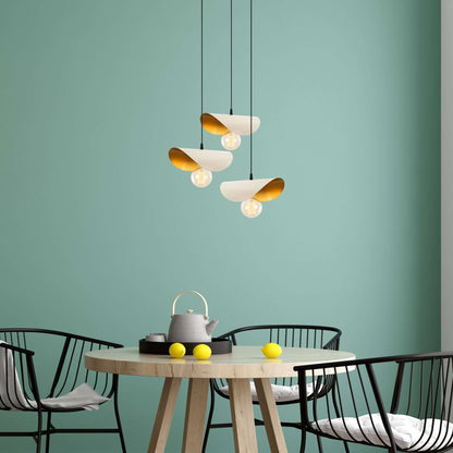 Eclipse Glow Pendant Trio with golden interior shades resembling flower petals.