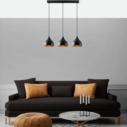 Industrial Ember Trio black pendant lights with warm amber glow, perfect for dining room, kitchen, or living space.