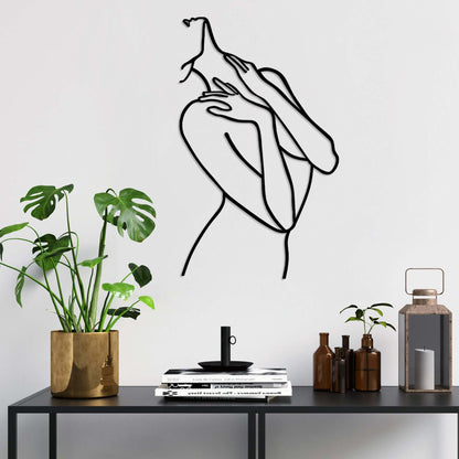 Elegant metal wall decor silhouette of graceful figure in soft pose, perfect for living room or bedroom.