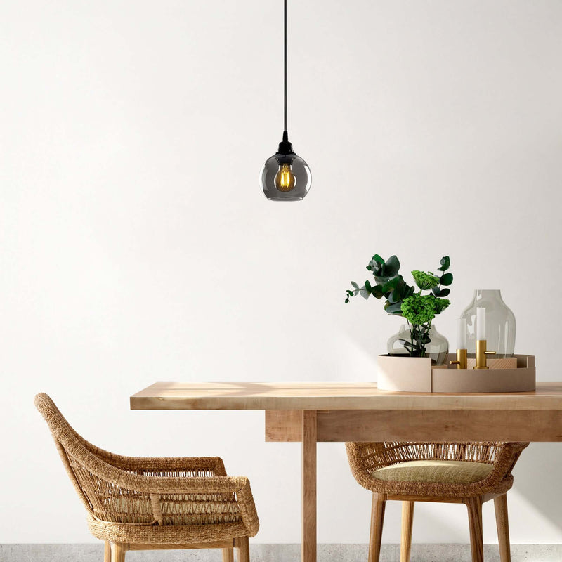 Fume Glow Pendant with sleek glass globe design for modern elegance in any space.