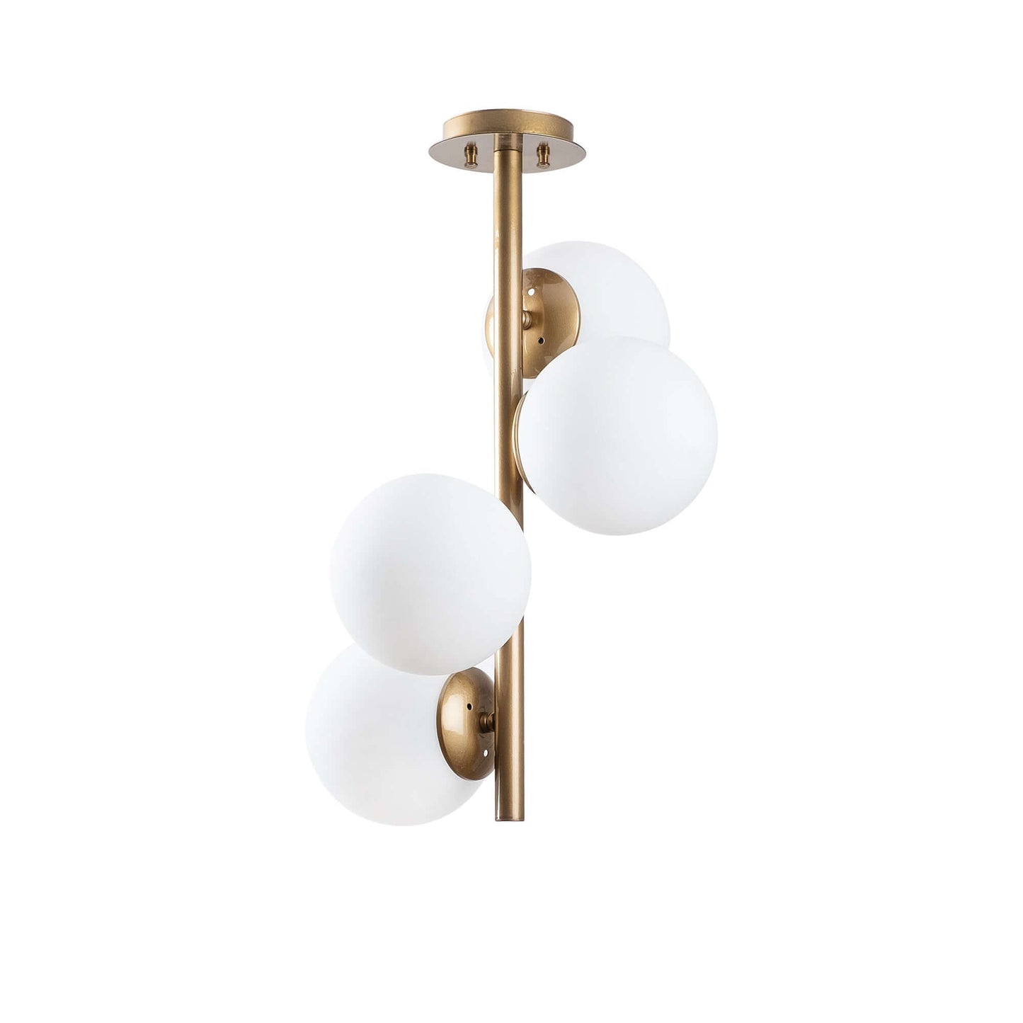 Globe Quad Gold pendant light fixture with four gold globes hanging from the ceiling.