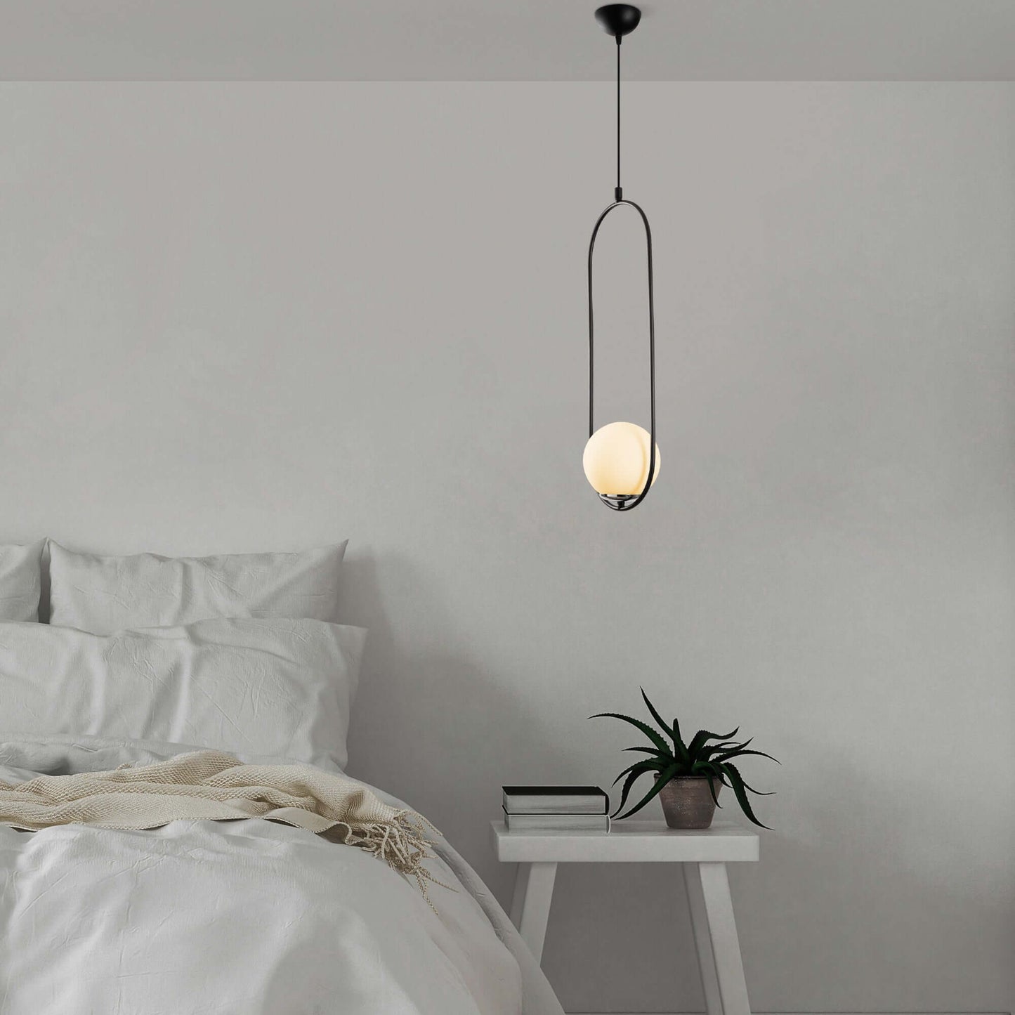 Luminous Pendant with open frame design and glowing orb, modern minimalist light fixture.