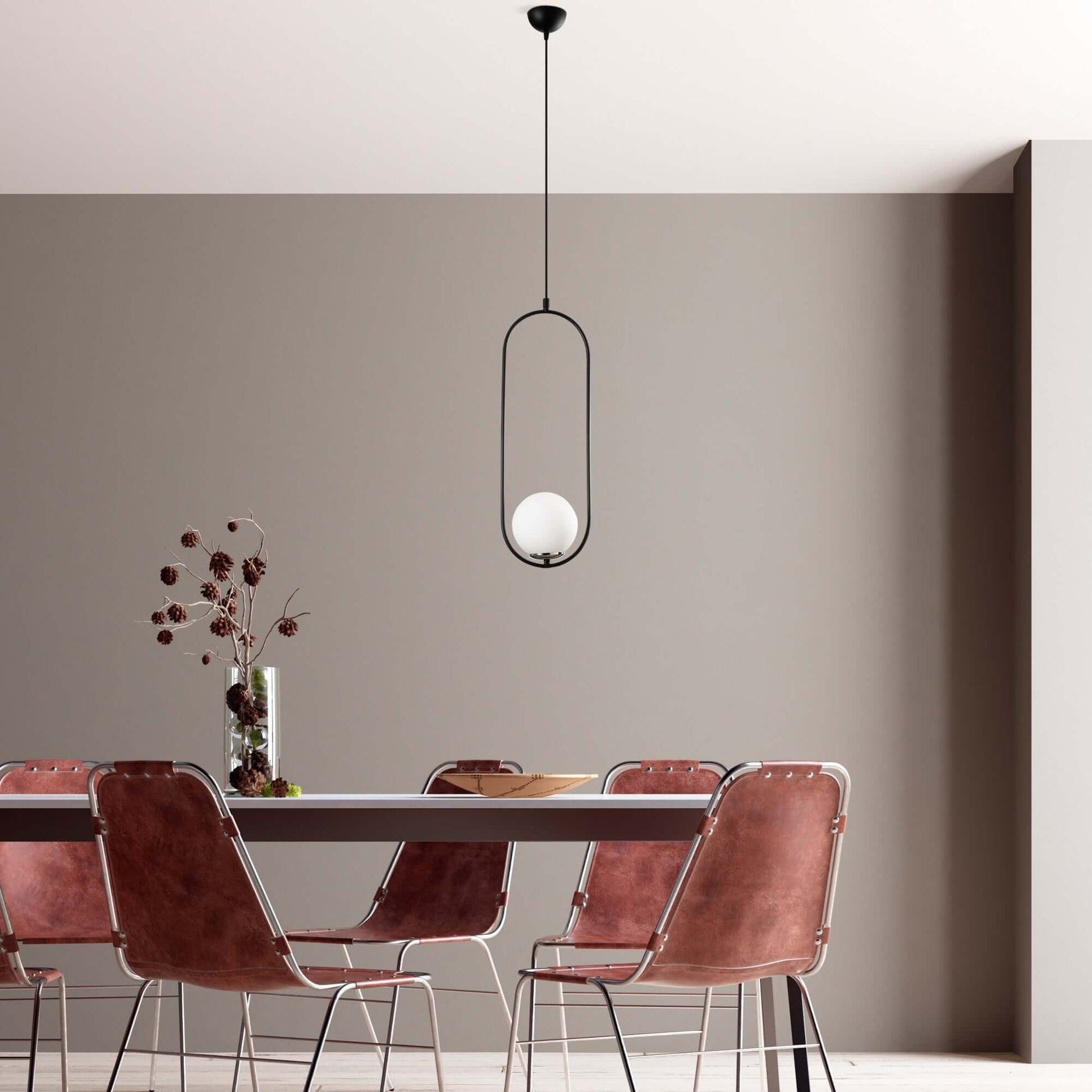 Luminous Pendant with open frame design and glowing orb, modern minimalist light fixture.