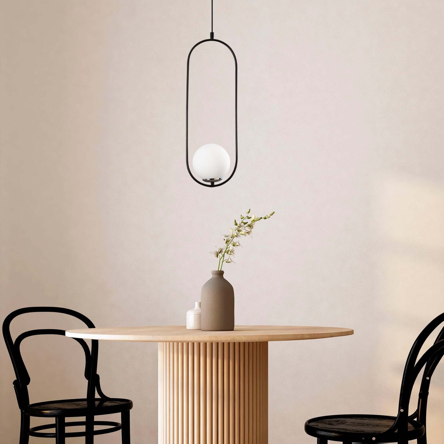 Luminous Pendant with open frame design and glowing orb, modern minimalist light fixture.