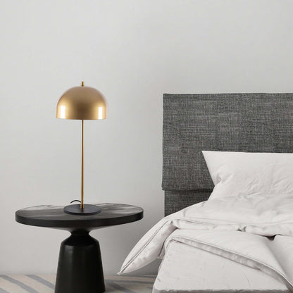 Modern gold dome desk lamp with minimalist design, perfect for workspace or living area