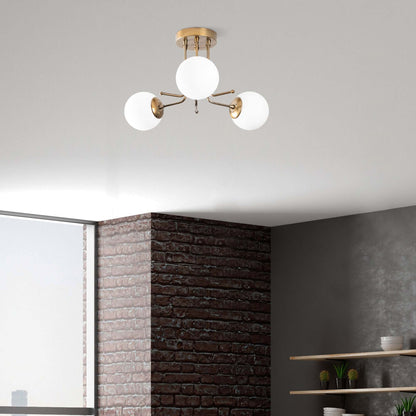 Orbital Brass Trio Chandelier with three sleek globes for modern spaces.