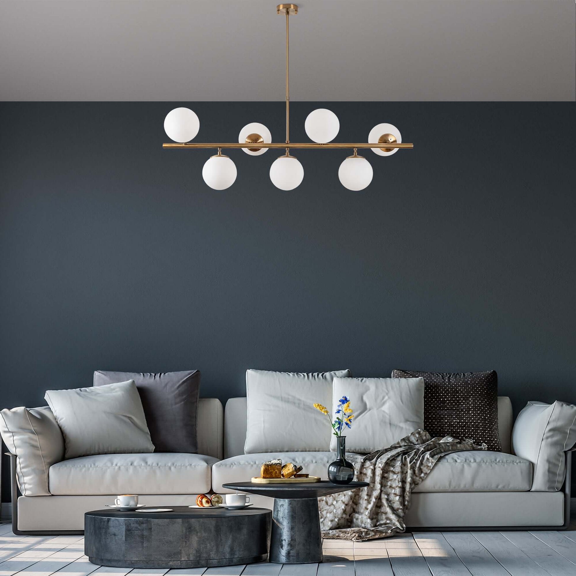 "Modern gold chandelier with frosted globes suspended on sleek bar"