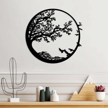 Metal wall decor with tranquil tree and birds in flight design, ideal for living rooms and studies.