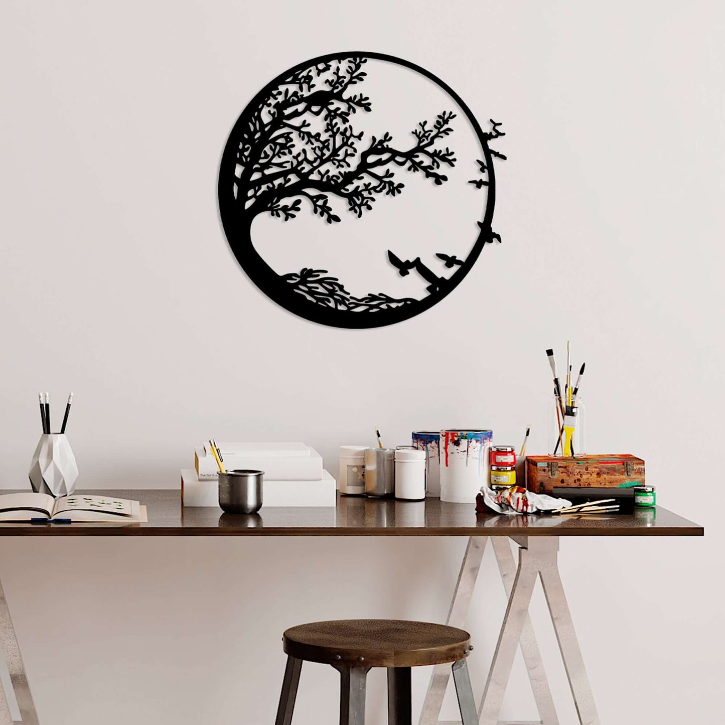 Metal wall decor featuring tranquil tree and birds in flight for serene room ambiance.