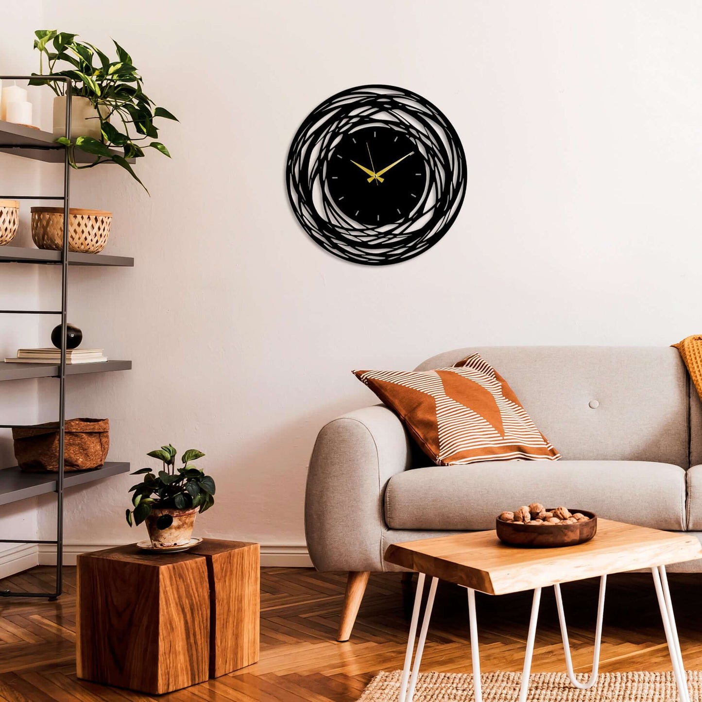 Whirlwind Elegance Wall Clock in sleek black metal with mesmerizing swirl design.